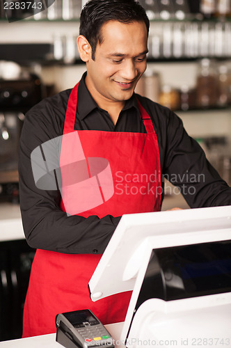 Image of Barista staff placing customers order in queue