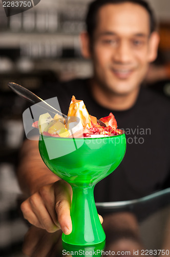 Image of Fruit cocktail served in presentable glass bowl