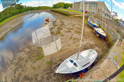 Image of boats on the river shore