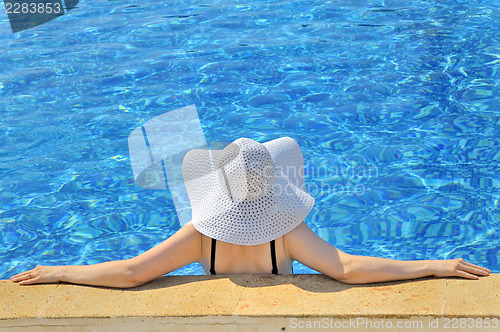 Image of Woman with white hat relaxing 
