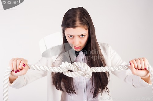 Image of business woman with knot of "problem"