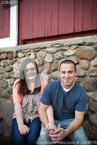 Image of Happy Couple Sitting Together