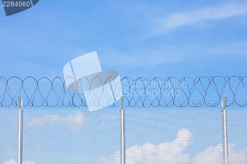 Image of Chain link fence with barbed wire 