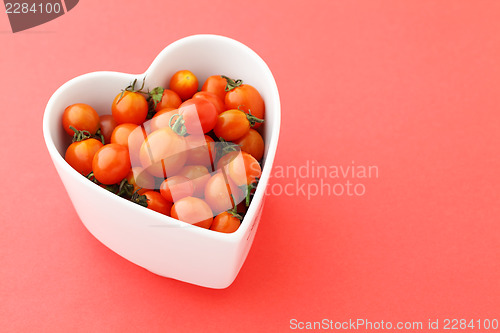 Image of Cherry tomato in heart shape bowl