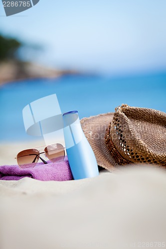 Image of sunprotection objects on the beach in holiday