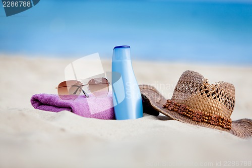 Image of sunprotection objects on the beach in holiday