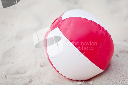 Image of beach ball in sand on the beach summertime holiday