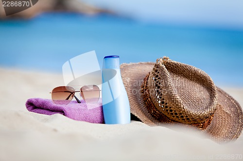 Image of sunprotection objects on the beach in holiday