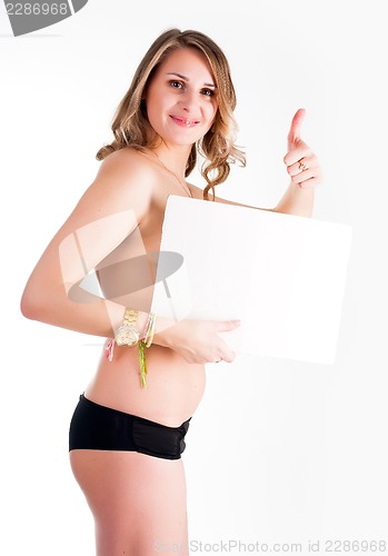 Image of sexy nude woman holding blank banner