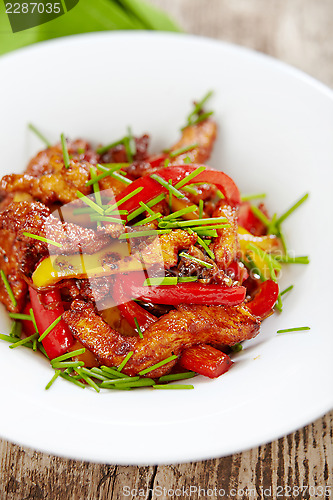 Image of fried meat and vegetable salad