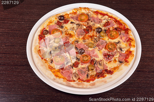 Image of pizza with ham and mushrooms