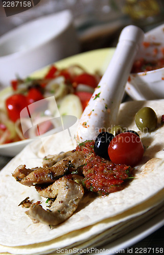 Image of Mexican food with tortillas and nachos 	