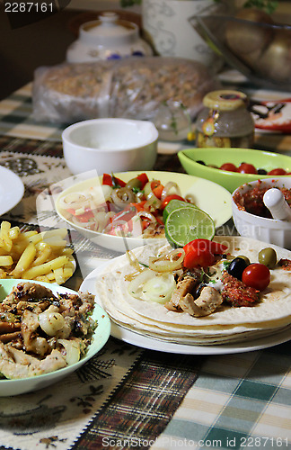 Image of Mexican food with tortillas and nachos 	