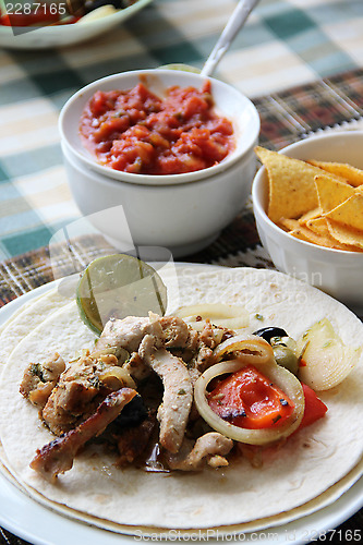 Image of Mexican food with tortillas and nachos 