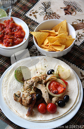 Image of Mexican food with tortillas and nachos 	