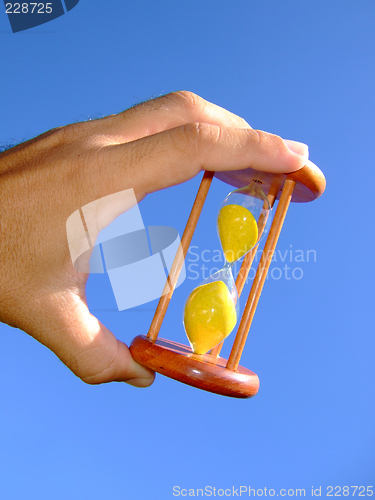 Image of Holding a sand-glass