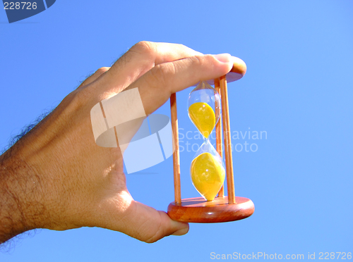 Image of Holding a sand-glass