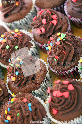 Image of Chocolate cupcakes with cream.