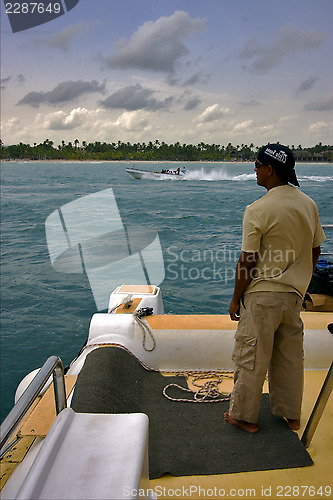 Image of man and  catamaran 