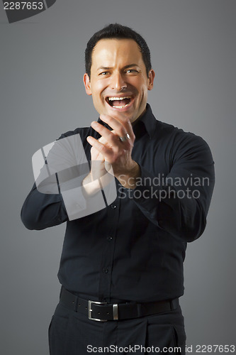 Image of man claps his hands