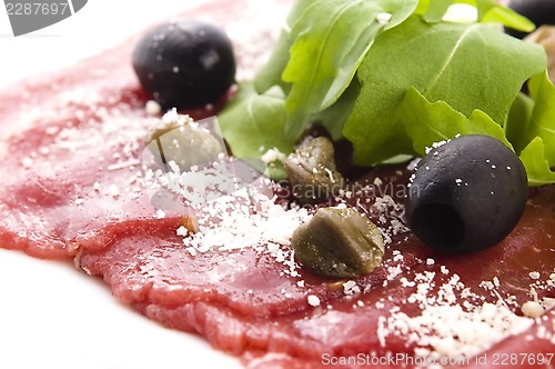 Image of Beef carpaccio with rucola and parmesan 