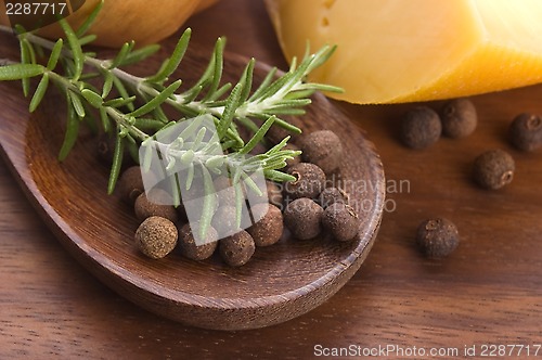 Image of allspice with fresh rosemary, cheese and onion