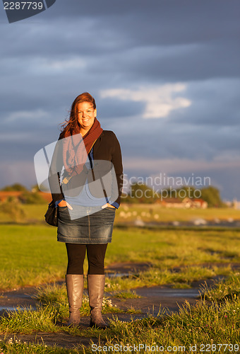Image of Woman standing at the dutch coast