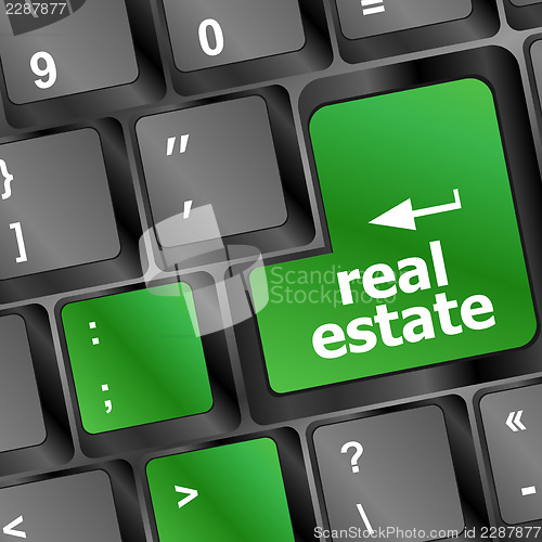 Image of real estate computer key showing internet concept