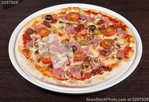 Image of pizza with ham and mushrooms