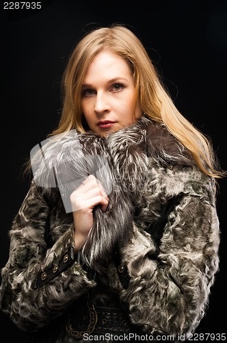 Image of Attractive woman in fur coat