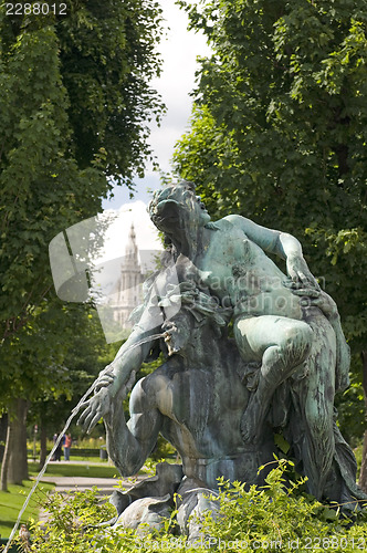 Image of fountain sculpture Vienna Austria  park with museum in backgroun