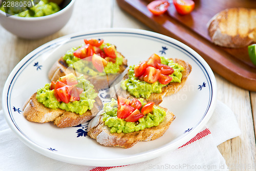 Image of Crostini with avocado and tomato