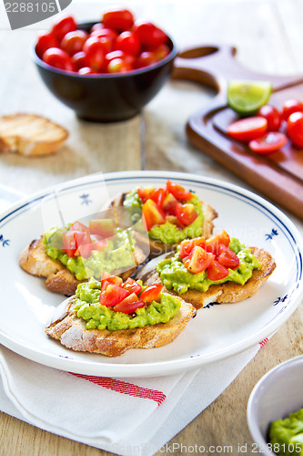 Image of Crostini with avocado and tomato