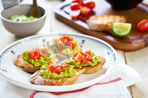 Image of Crostini with avocado and tomato