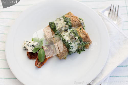 Image of Tasty salty pancakes with spinach