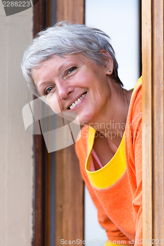 Image of Smiling modern mature woman