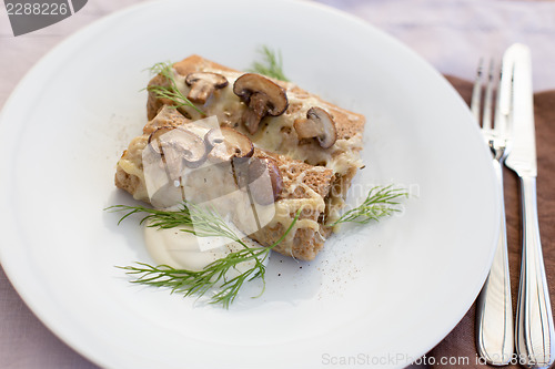 Image of Delicious salty pancakes with mushrooms