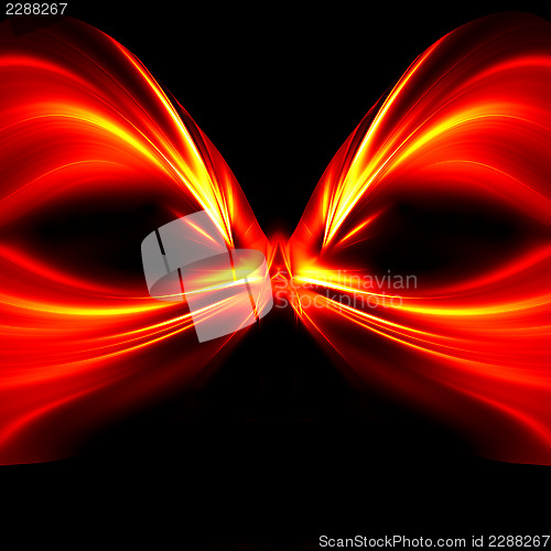 Image of Abstract mask of red and yellow rays on black