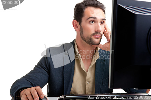 Image of Suprised Man Looking At A Computer Monitor