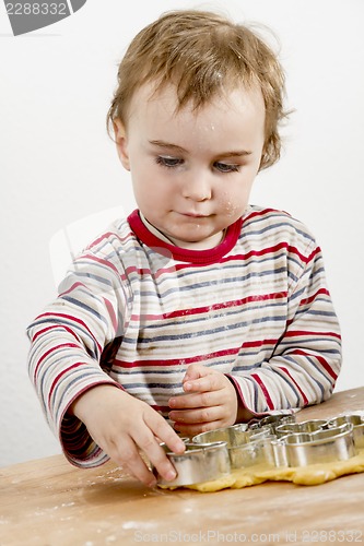 Image of young child making cookies