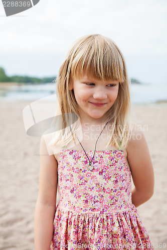 Image of Smiling young girl at beach