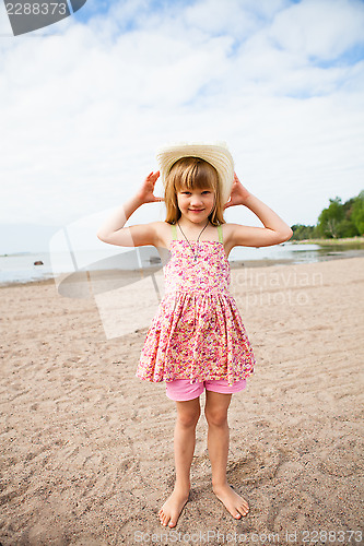 Image of Smiling young girl at beach