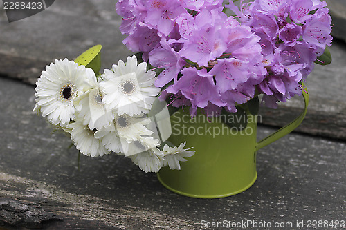 Image of garden flowers in a watering-can