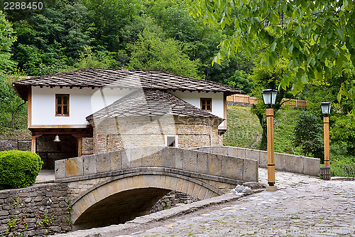 Image of Old house and a stone bridge in the architectural complex Etara,