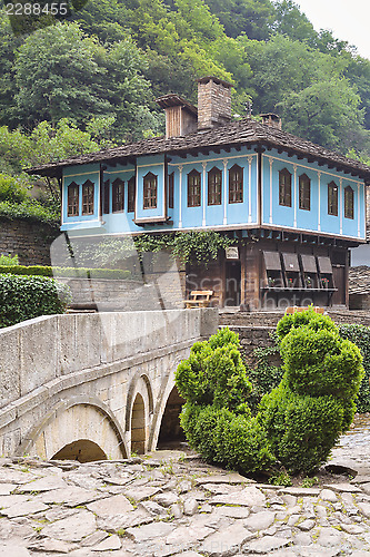 Image of Old house and a stone bridge in the architectural complex Etara,