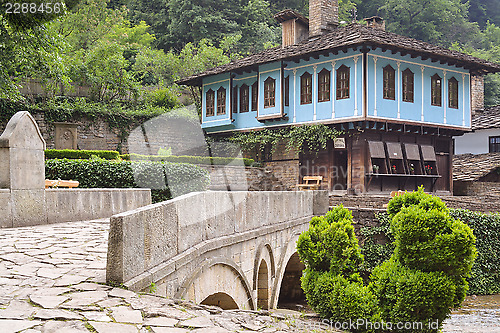 Image of Old house and a stone bridge in the architectural complex Etara,