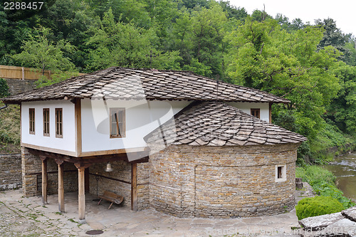 Image of The church St. Epiphan with the old school in Etara, Bulgaria