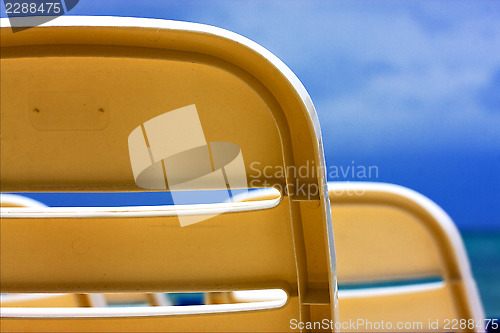 Image of    plastic chair  in the sky