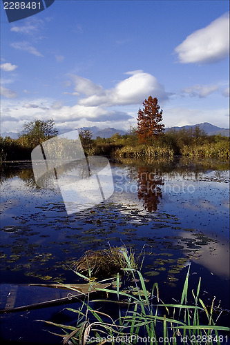 Image of boat fall down autumn lake  