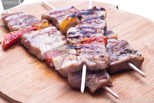 Image of mixed meat skewer on wooden